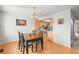 Bright dining area with wood floors and views to the kitchen at 770 S Youngfield, Lakewood, CO 80228