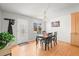 Bright dining room with wood floors and a traditional table set at 770 S Youngfield, Lakewood, CO 80228