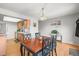 Cozy dining area features wooden table and chairs, with a view into the adjacent kitchen space at 770 S Youngfield, Lakewood, CO 80228