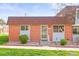 Charming brick home featuring a well-kept lawn and decorative front garden at 770 S Youngfield, Lakewood, CO 80228