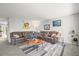 Spacious living room featuring a large comfortable sectional and a modern rug at 770 S Youngfield, Lakewood, CO 80228