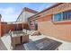 Well-maintained brick patio with outdoor dining table and landscaped surroundings at 770 S Youngfield, Lakewood, CO 80228