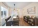 Bright dining room featuring an elongated wooden table, a long bench, and attractive decor at 5354 Blue Lunar Ln, Castle Rock, CO 80104