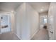 Long hallway with neutral colors that features doors to bedrooms and bathrooms at 5354 Blue Lunar Ln, Castle Rock, CO 80104