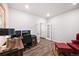 Bright home office featuring wood floors, a large desk and natural light perfect for remote work at 5354 Blue Lunar Ln, Castle Rock, CO 80104
