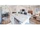 Open concept kitchen with granite countertops and stainless steel appliances overlooking the living room at 5354 Blue Lunar Ln, Castle Rock, CO 80104