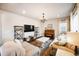 Spacious living room featuring hardwood floors, a decorative chandelier, and ample seating at 5354 Blue Lunar Ln, Castle Rock, CO 80104