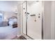 Modern shower with sleek fixtures, white tile, and open access to a stylish primary suite at 5354 Blue Lunar Ln, Castle Rock, CO 80104