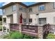 Inviting back deck with outdoor seating, a red umbrella, and a propane heater for cozy evenings at 913 Alkire Ct, Golden, CO 80401
