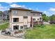 Aerial view of the backyard showing lush grass, patio, a deck, and landscaped areas at 913 Alkire Ct, Golden, CO 80401