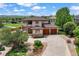 Beautiful two-story home featuring a 3-car garage, lush landscaping and scenic views at 913 Alkire Ct, Golden, CO 80401