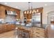 Modern kitchen with stainless steel appliances, stone countertops and custom wood island at 913 Alkire Ct, Golden, CO 80401