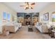 Spacious living room featuring a stone fireplace, built-in shelves, and lots of natural light at 913 Alkire Ct, Golden, CO 80401
