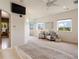 Bright main bedroom with sitting area, complemented by large windows and an open view to the ensuite at 913 Alkire Ct, Golden, CO 80401