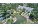Aerial view of a condo community with a small pond and lush landscaping at 8600 E Alameda Ave # 17-203, Denver, CO 80247