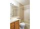 Neutral bathroom includes vanity and a shower over tub with tile surround at 8600 E Alameda Ave # 17-203, Denver, CO 80247