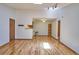 Bright living room with wood floors and track lighting offers versatile space at 8600 E Alameda Ave # 17-203, Denver, CO 80247