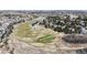 Enjoy scenic aerial views of a beautiful golf course and lush green landscapes in a tranquil and picturesque community at 1229 Berganot Trl, Castle Pines, CO 80108