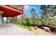 Spacious backyard with a stamped concrete patio and mature trees, perfect for outdoor entertaining at 1229 Berganot Trl, Castle Pines, CO 80108