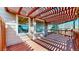 Backyard patio showcasing a red pergola, outdoor space and privacy fence at 1229 Berganot Trl, Castle Pines, CO 80108