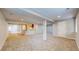 Large finished basement with kitchenette, neutral carpet, and ample open space at 1229 Berganot Trl, Castle Pines, CO 80108