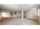 Large basement with carpet and a partial kitchen, offering potential for customization at 1229 Berganot Trl, Castle Pines, CO 80108