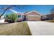 Charming home with a well-manicured lawn, large driveway, and inviting facade at 1229 Berganot Trl, Castle Pines, CO 80108