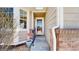 Inviting front entryway of home with charming brick accents and stylish storm door at 1229 Berganot Trl, Castle Pines, CO 80108