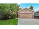Charming single-Gathering home featuring a manicured lawn, mature trees, and inviting curb appeal at 1229 Berganot Trl, Castle Pines, CO 80108