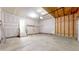 Clean two car garage featuring drywall and concrete floor at 1229 Berganot Trl, Castle Pines, CO 80108