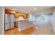 Basement kitchenette featuring stainless steel appliances, wooden cabinets, and granite counters at 1229 Berganot Trl, Castle Pines, CO 80108