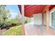 Covered patio with stone tile floor and view of yard at 1229 Berganot Trl, Castle Pines, CO 80108