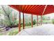 Covered patio with stone tile floor and view of yard at 1229 Berganot Trl, Castle Pines, CO 80108