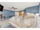 Spacious primary bedroom suite featuring a king bed and barn door to the ensuite bathroom at 11885 Helena St, Commerce City, CO 80022