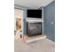 Bedroom featuring a fireplace, TV, and entrance to the ensuite bathroom and walk-in closet at 11885 Helena St, Commerce City, CO 80022