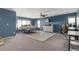 Primary bedroom with an ensuite bathroom, a king bed, and a dedicated workspace at 11885 Helena St, Commerce City, CO 80022