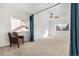 Spacious bonus room with a comfortable leather chair, large windows, and natural light at 11885 Helena St, Commerce City, CO 80022