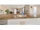 Stylish kitchen island with granite countertop, stainless steel sink, and modern faucet at 11885 Helena St, Commerce City, CO 80022