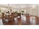 Bright living room with hardwood floors, large windows, and stylish furnishings at 11885 Helena St, Commerce City, CO 80022