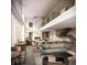 Open-concept lounge with a fireplace, dining area, modern furnishings, and stylish decor for social gatherings at 525 18Th St # 1201, Denver, CO 80202