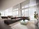 Bright, open living room with high ceilings, large windows, and stylish contemporary furniture at 525 18Th St # 1201, Denver, CO 80202