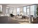 Bright living room with floor-to-ceiling windows, wood floors, dining space, and stylish contemporary furnishings at 525 18Th St # 1201, Denver, CO 80202