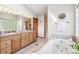 Bathroom with a tub, double sinks and a vanity providing ample space and functionality at 942 Xenon Ct, Golden, CO 80401