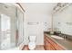 Bathroom featuring a glass enclosed shower and a spacious vanity with ample counter space at 942 Xenon Ct, Golden, CO 80401