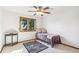 Minimalist bedroom design with a single bed, area rug, and a window for natural light at 942 Xenon Ct, Golden, CO 80401