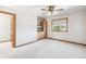 Bright bedroom with a ceiling fan, window, and built-in storage providing ample space at 942 Xenon Ct, Golden, CO 80401