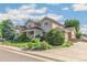 Beautiful two-story home boasting manicured landscaping, lush greenery, and inviting curb appeal at 942 Xenon Ct, Golden, CO 80401