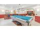 Spacious game room features a billiard table and a bar, perfect for entertaining guests at 942 Xenon Ct, Golden, CO 80401