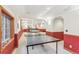 Game room featuring ping pong table with basement bar and other areas of the basement at 942 Xenon Ct, Golden, CO 80401