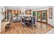 Spacious kitchen and dining area with granite countertops, stainless steel appliances, and hardwood floors at 942 Xenon Ct, Golden, CO 80401